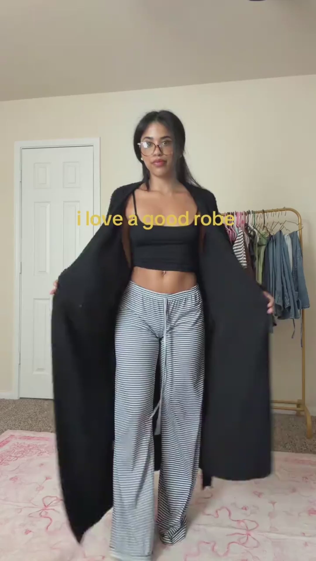 Woman opening the long robe in Onyx to show its length