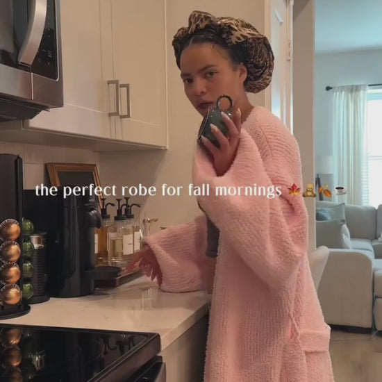 Woman in the long robe in Blush making coffee in her kitchen