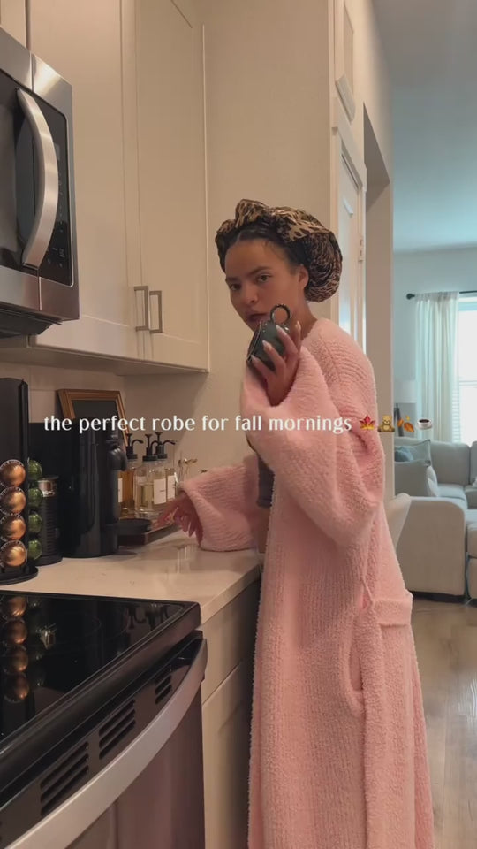Woman in the long robe in Blush making coffee in her kitchen