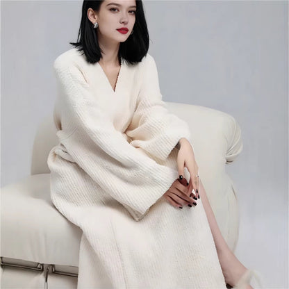 Long robe in Ivory with overlapping V-neck front and wide ribbed sleeves, worn seated