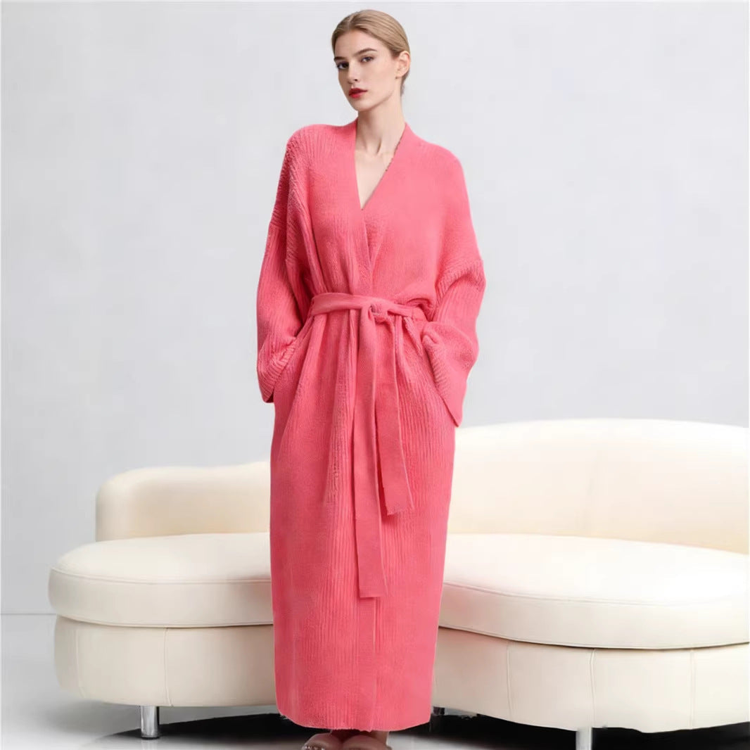 Long robe in Salmon worn standing in front of a cream sofa